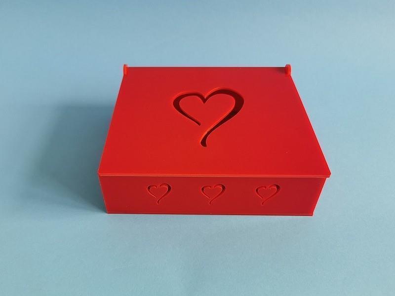 Red acrylic box with lid and heart motif
